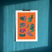 Art print of green angry blob cats on a bright orange background