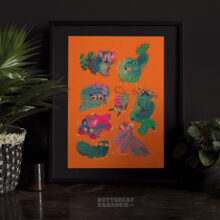 Art print of green angry blob cats on a bright orange background